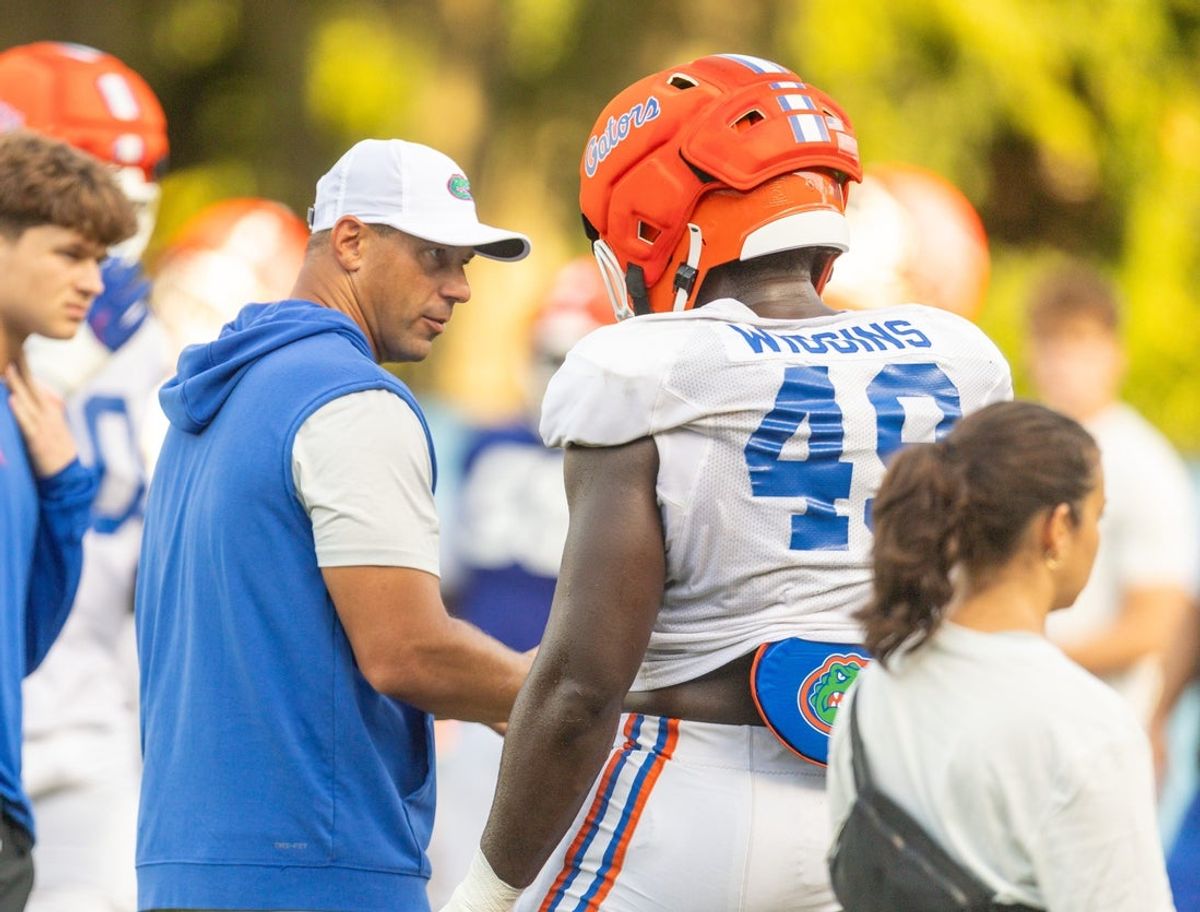 Florida 2026-2027 head coach Jon Sumrall talks with Florida 2026-2027 defensive lineman Jalen Wiggins (49) during Florida football practice at Heavener Football Complex in Gainesville, FL on Tuesday, August 18, 2026. [Alan Youngblood/Gainesville Sun]