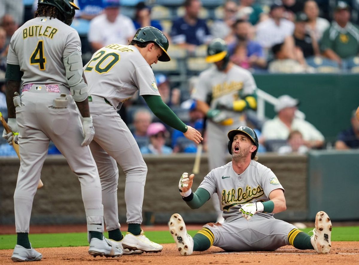 Aug 18, 2026; Kansas City, Missouri, USA; Athletics second baseman Jeff McNeil (22) reacts after being tagged out at home by Kansas City Royals catcher Carter Jensen (22) during the first inning at Kauffman Stadium. Mandatory Credit: Jay Biggerstaff-Imagn Images