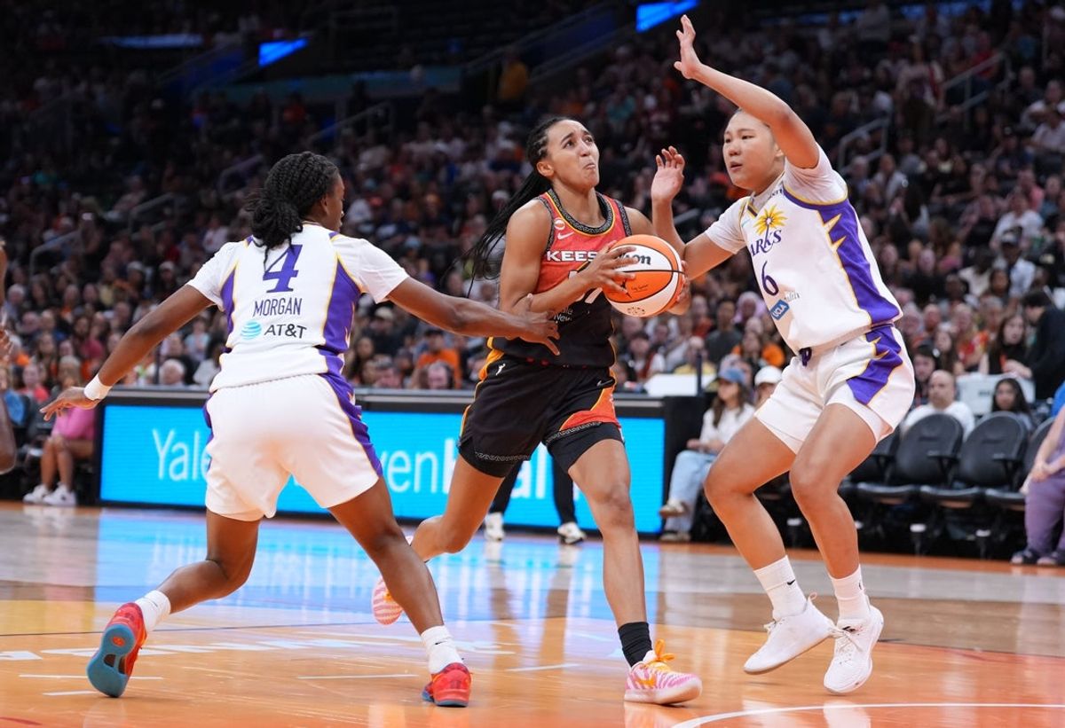 Aug 18, 2026; Boston, Massachusetts, USA; Connecticut Sun guard Leila Lacan (47) drives the ball against Los Angeles Sparks forward Jihyun Park (6) and guard Tonie Morgan (4) in the first half at TD Garden. Mandatory Credit: David Butler II-Imagn Images