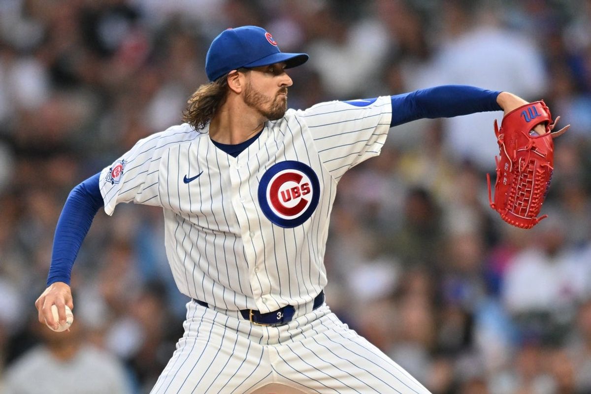 Aug 18, 2026; Chicago, Illinois, USA; Chicago Cubs pitcher Kevin Gausman (12) pitches against the Chicago White Sox during the first inning at Wrigley Field. Mandatory Credit: Patrick Gorski-Imagn Images