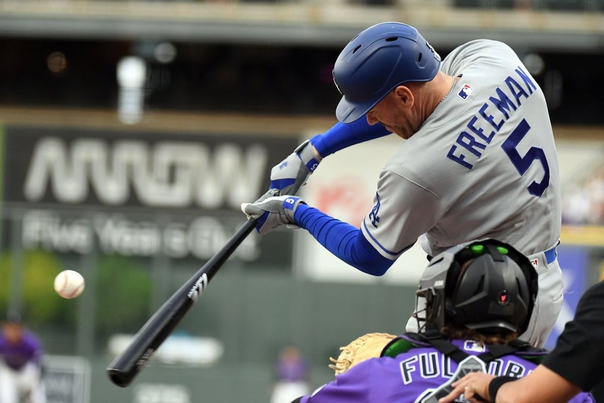 Aug 18, 2026; Denver, Colorado, USA; Los Angeles Dodgers infielder Freddie Freeman (5) singles in the first inning against the Colorado Rockies at Coors Field. Mandatory Credit: Christopher Hanewinckel-Imagn Images