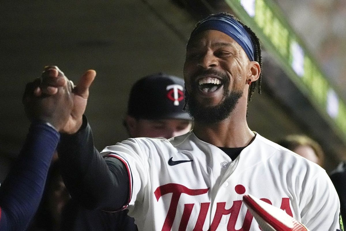 Aug 18, 2026; Minneapolis, Minnesota, USA; Minnesota Twins pinch hitter Byron Buxton (25) celebrates his run against the Atlanta Braves in the eighth inning at Target Field. Mandatory Credit: Bruce Kluckhohn-Imagn Images
