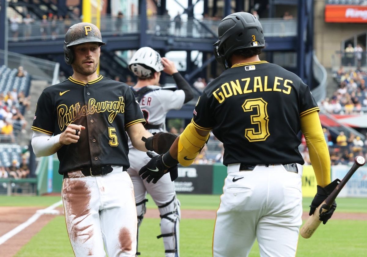 Aug 19, 2026; Pittsburgh, Pennsylvania, USA; Pittsburgh Pirates second baseman Nick Gonzales (3) greets designated hitter Brandon Lowe (5) crossing home plate to score a run against the Detroit Tigers during the first inning at PNC Park. Mandatory Credit: Charles LeClaire-Imagn Images