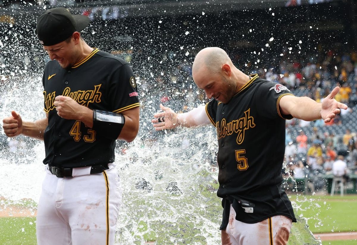 Aug 19, 2026; Pittsburgh, Pennsylvania, USA; Pittsburgh Pirates catcher Rafael Flores Jr. (43) and designated hitter Brandon Lowe (5) are splashed with water after hitting solo home runs in the ninth inning to help defeat the Detroit Tigers at PNC Park. Mandatory Credit: Charles LeClaire-Imagn Images