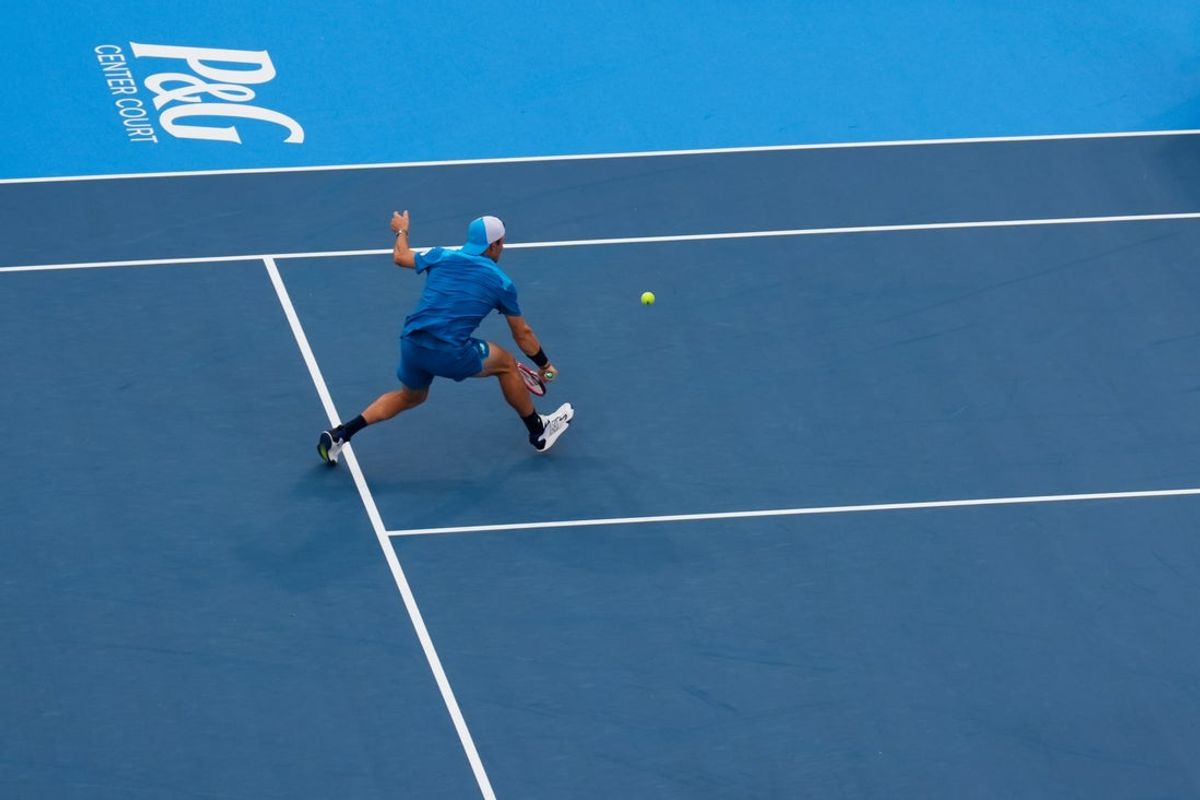 Aug 19, 2026; Mason, OH, USA;  Tommy Paul (USA) returns a shot against Alexander Zverev (GER) during the Cincinnati Open at Lindner Family Tennis Center. Mandatory Credit: Aaron Doster-Imagn Images
