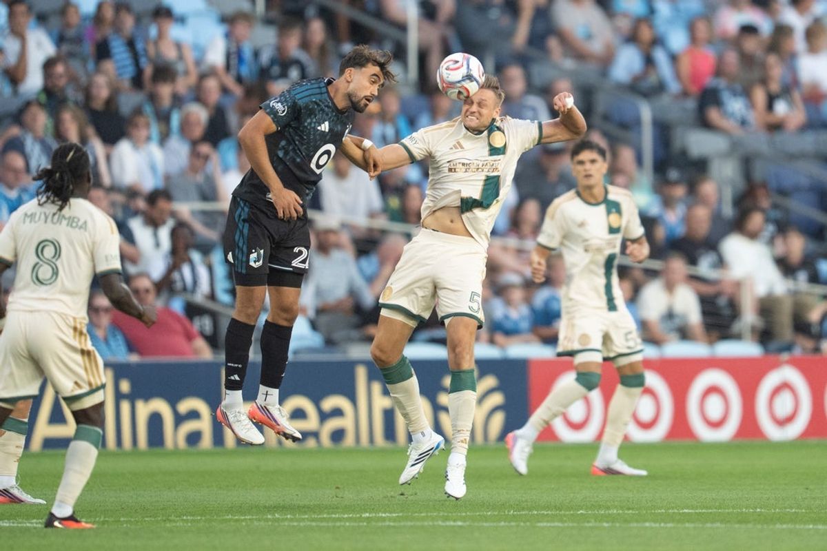Aug 19, 2026; Saint Paul, Minnesota, USA; Atlanta United defender Stian Gregersen (5) heads the ball in front of Minnesota United FC offense Marcus Caldeira (22) in the first half at Allianz Field. Mandatory Credit: Matt Blewett-Imagn Images