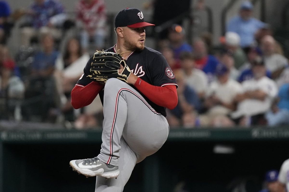 Aug 19, 2026; Arlington, Texas, USA;  Washington Nationals pitcher Cade Cavalli (24) goes into the windup against the Texas Rangers during the fourth inning at Globe Life Field. Mandatory Credit: Raymond Carlin III-Imagn Images
