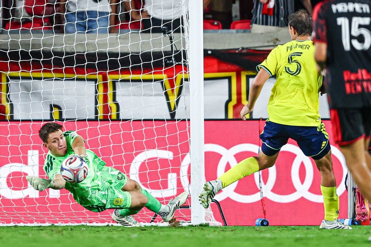 Aug 19, 2026; Harrison, New Jersey, USA; Nashville SC goalkeeper Brian Schwake (99) makes a save against the New York Red Bulls during the second half at Sports Illustrated Stadium. Mandatory Credit: Vincent Carchietta-Imagn Images