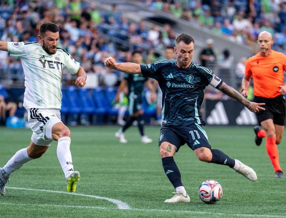 Aug 19, 2026; Seattle, Washington, USA;  Seattle Sounders midfielder Albert Rusnak (11) attempts a shot against Austin FC defender Brendan Hines-Ike (4) during the first half at Lumen Field. Mandatory Credit: Stephen Brashear-Imagn Images