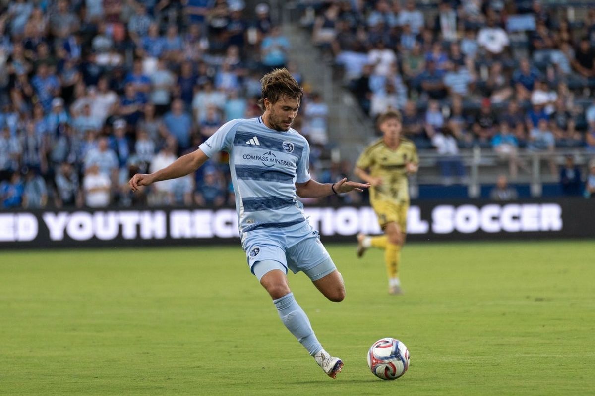Aug 19, 2026; Kansas City, Kansas, USA; Sporting Kansas City midfielder Jake Davis (8) kicks the ball during the first half against St. Louis CITY SC at Children's Mercy Park. Mandatory Credit: Kylie Graham-Imagn Images