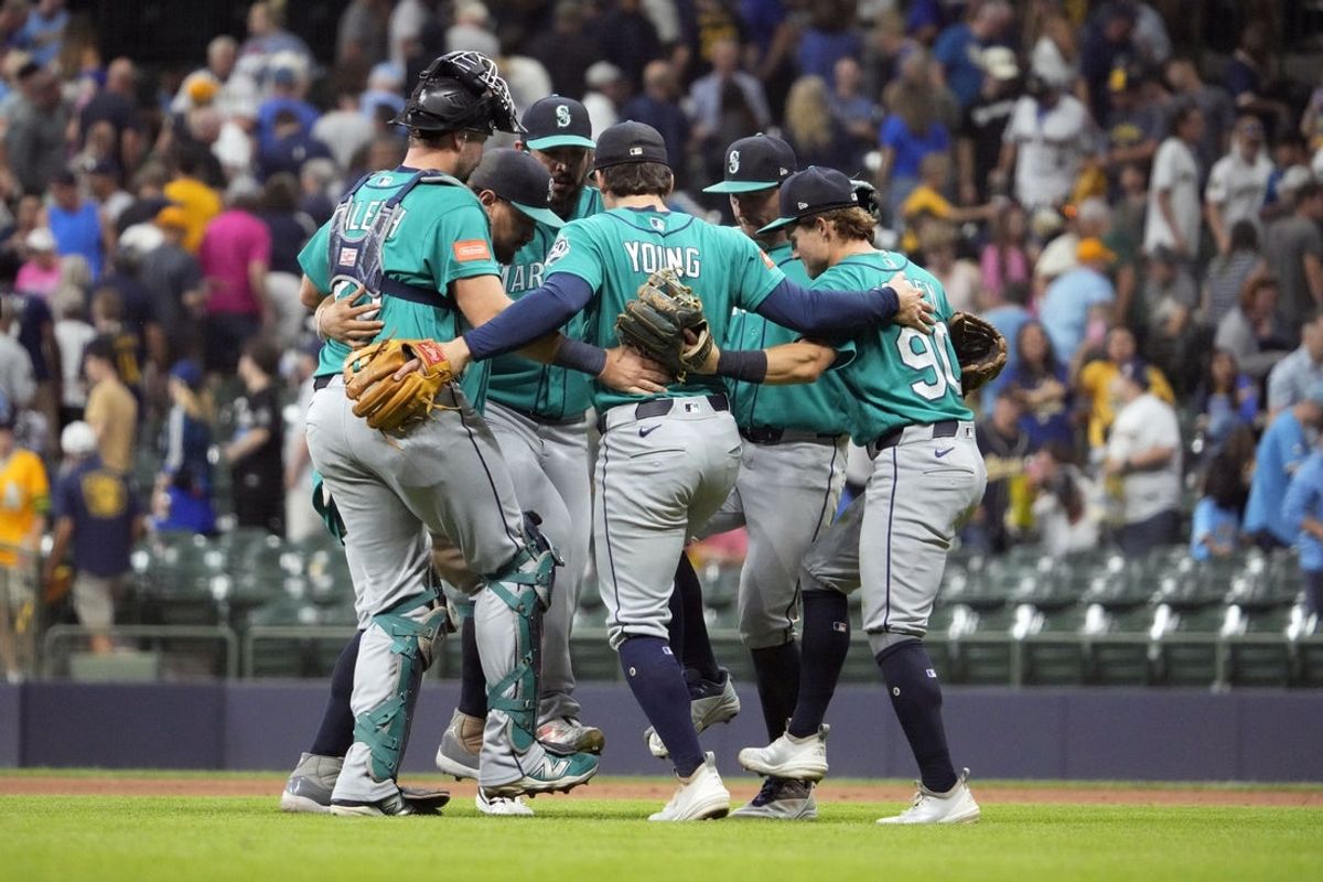 Aug 19, 2026; Milwaukee, Wisconsin, USA; Seattle Mariners celebrate a 7-5 win over the Milwaukee Brewers  at American Family Field. Mandatory Credit: Michael McLoone-Imagn Images
