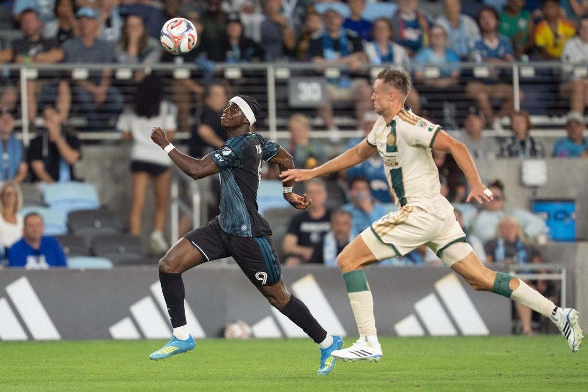 Aug 19, 2026; Saint Paul, Minnesota, USA; Minnesota United FC offense Kelvin Yeboah (9) and Atlanta United defender Stian Gregersen (5) play a long pass in the second half at Allianz Field. Mandatory Credit: Matt Blewett-Imagn Images