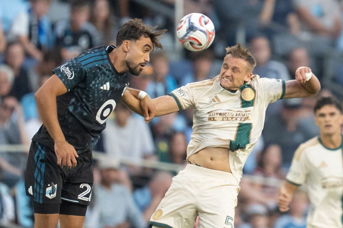 Aug 19, 2026; Saint Paul, Minnesota, USA; Minnesota United FC offense Marcus Caldeira (22) and Atlanta United defender Stian Gregersen (5) play the ball in the first half at Allianz Field. Mandatory Credit: Matt Blewett-Imagn Images