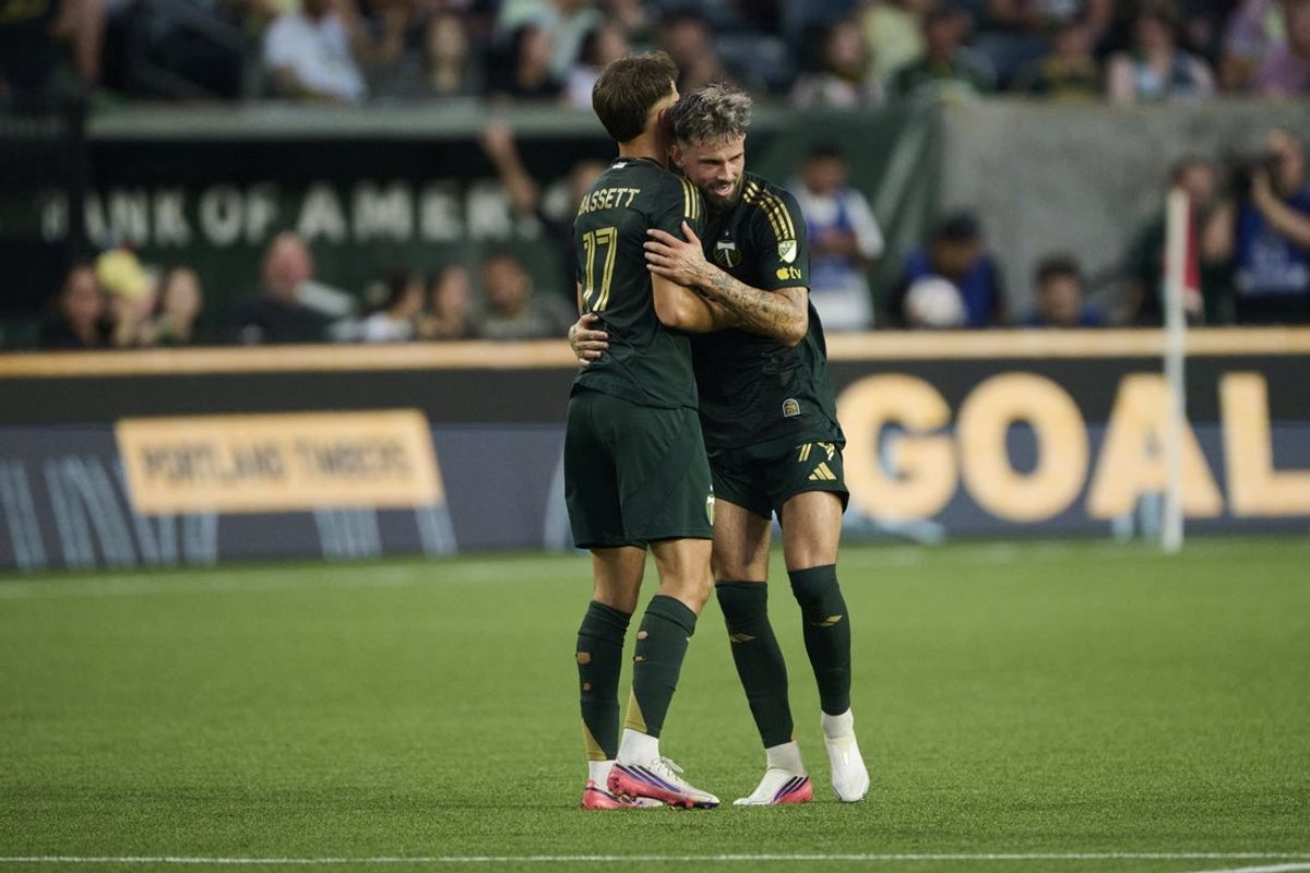 Aug 19, 2026; Portland, Oregon, USA; Portland Timbers forward Kristoffer Velde (99) celebrates with midfielder Cole Bassett (17) after scoring a goal during the first half against San Diego FC at Providence Park. Mandatory Credit: Troy Wayrynen-Imagn Images