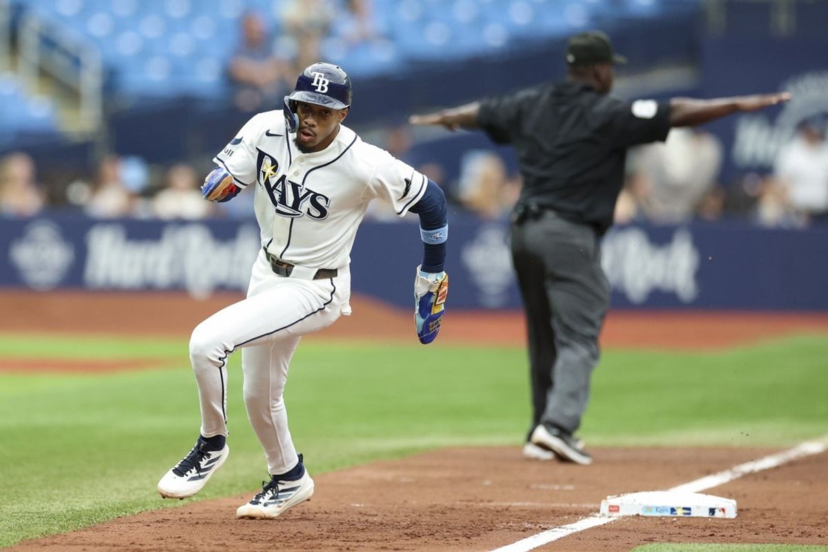 Aug 20, 2026; St. Petersburg, Florida, USA; Tampa Bay Rays left fielder Chandler Simpson (14) rounds third base to score a run against the Toronto Blue Jays in the fourth inning at Tropicana Field. Mandatory Credit: Nathan Ray Seebeck-Imagn Images