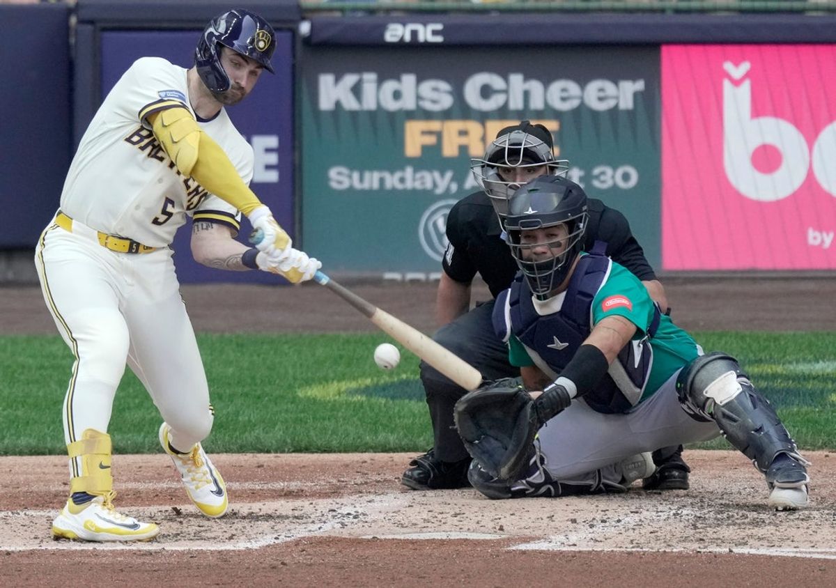 Milwaukee Brewers center fielder Garrett Mitchell (5) hits a double during the third inning of their game against the Seattle Mariners Thursday, August 20, 2026 at American Family Field in Milwaukee, Wisconsin.