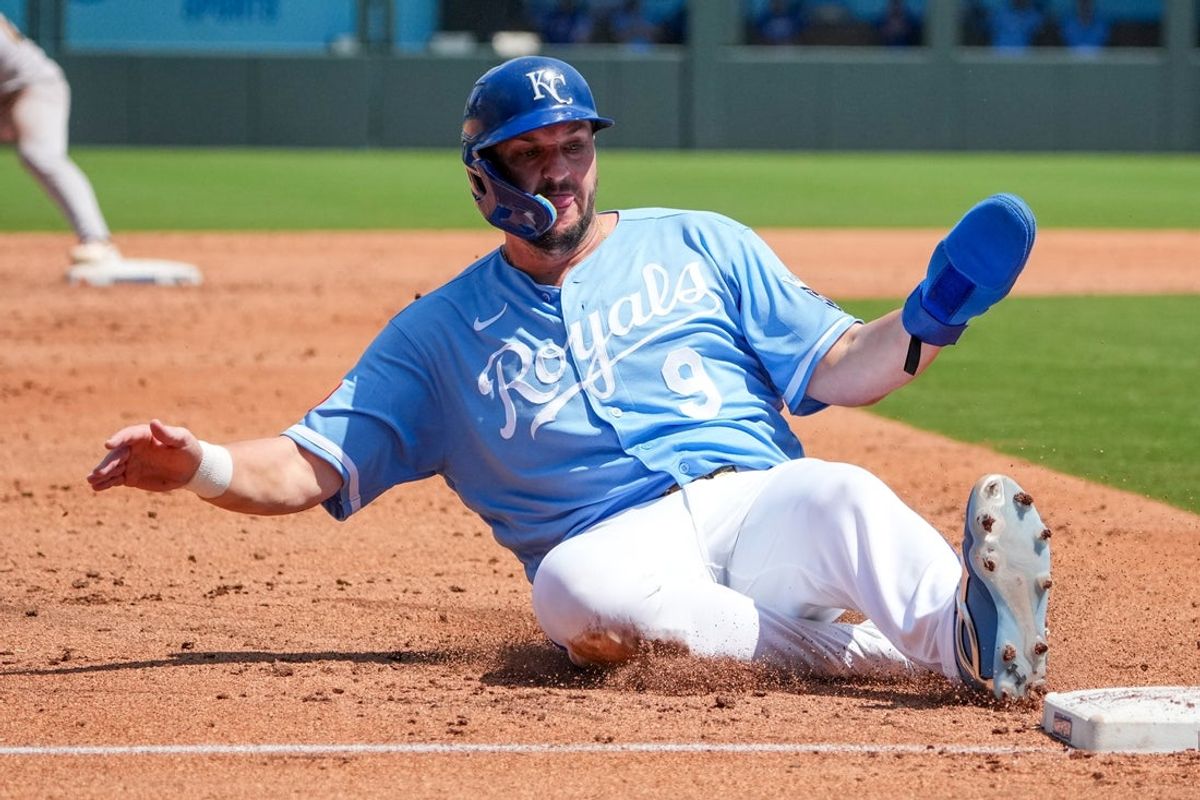 Aug 20, 2026; Kansas City, Missouri, USA; Kansas City Royals designated hitter Vinnie Pasquantino (9) slides safely into third against the Athletics during the third inning at Kauffman Stadium. Mandatory Credit: Denny Medley-Imagn Images