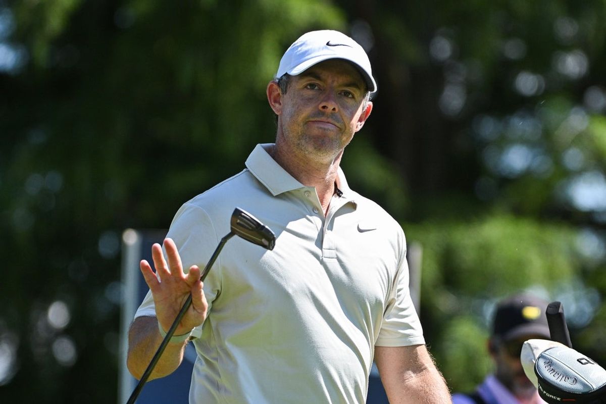 Aug 20, 2026; Saint Louis, Missouri, USA;  Rory McIlroy waves to the crowd as he walks to the thirteenth green during the first round of the BMW Championship golf tournament. Mandatory Credit: Jeff Curry-Imagn Images