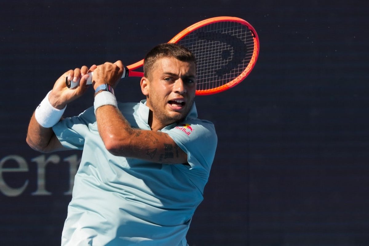 Aug 20, 2026; Mason, OH, USA;  Flavio Cobolli (ITA) returns a shot against Tommy Paul (USA) during the Cincinnati Open at Lindner Family Tennis Center. Mandatory Credit: Aaron Doster-Imagn Images