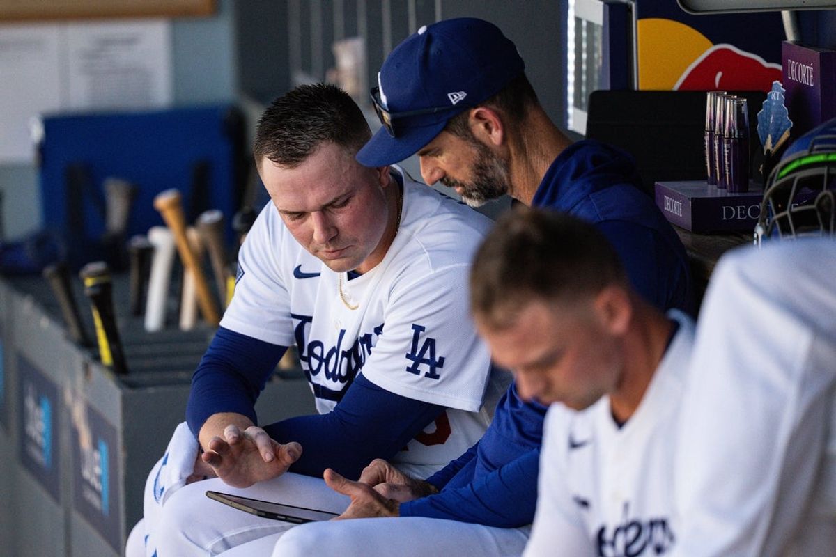 Aug 16, 2026; Los Angeles, California, USA; Los Angeles Dodgers pitcher Tarik Skubal (29) and pitching coach Mark Prior (99) study during the sixth inning against the Milwaukee Brewers at Dodger Stadium. Mandatory Credit: Jon Endow-Imagn Images