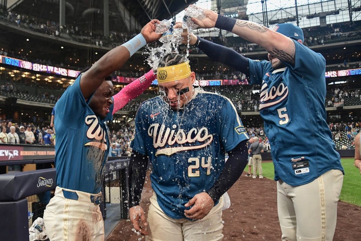 Aug 21, 2026; Milwaukee, Wisconsin, USA;  Milwaukee Brewers left fielder Luis Lara (18) and center fielder Garrett Mitchell (5) pours water on catcher William Contreras (24) after beating the Atlanta Braves at American Family Field.  Mandatory Credit: Benny Sieu-Imagn Images