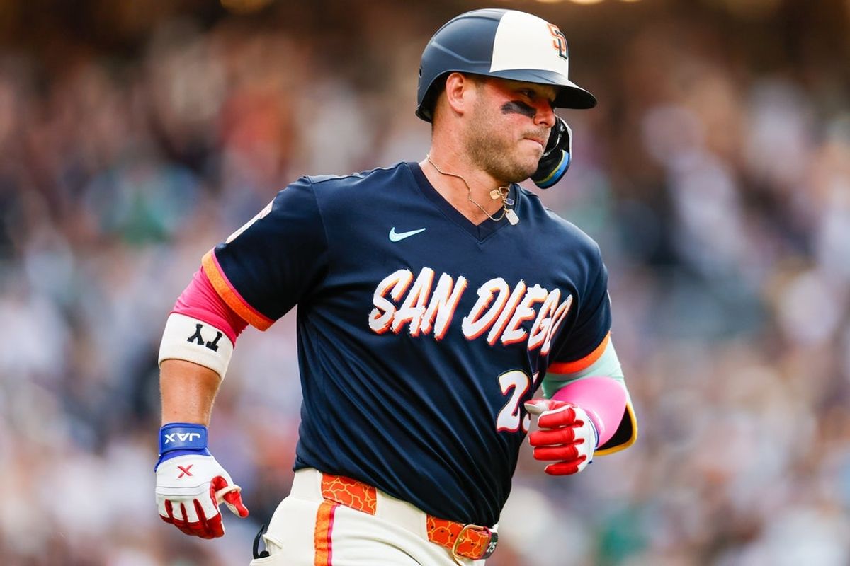 Aug 21, 2026; San Diego, California, USA;  San Diego Padres first baseman Ty France (25) hits a two-run home run during the first inning against the Minnesota Twins at Petco Park.  Mandatory Credit: David Frerker-Imagn Images