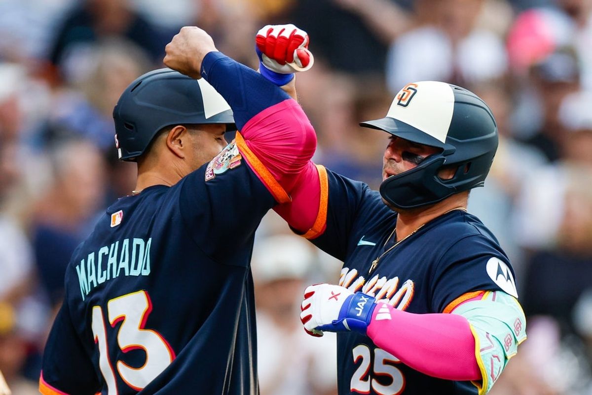 Aug 21, 2026; San Diego, California, USA;  San Diego Padres first baseman Ty France (25) celebrates with third baseman Manny Machado (13) after hitting a two-run home run during the first inning against the Minnesota Twins at Petco Park.  Mandatory Credit: David Frerker-Imagn Images