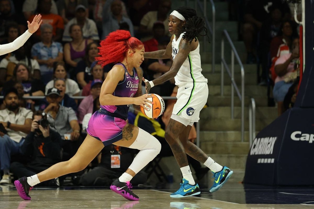 Aug 21, 2026; Washington, District of Columbia, USA; Washington Mystics center Shakira Austin (0) drives to the basket as Minnesota Lynx forward Natasha Howard (1) defends in the second half at CareFirst Arena. Mandatory Credit: Geoff Burke-Imagn Images