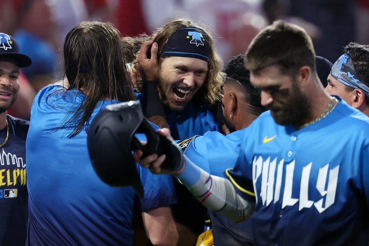 Aug 21, 2026; Philadelphia, Pennsylvania, USA; Philadelphia Phillies third baseman Alec Bohm (28) celebrates with teammates after hitting a game winning two RBI walk off triple in the tenth inning against the St. Louis Cardinals at Citizens Bank Park. Mandatory Credit: Bill Streicher-Imagn Images