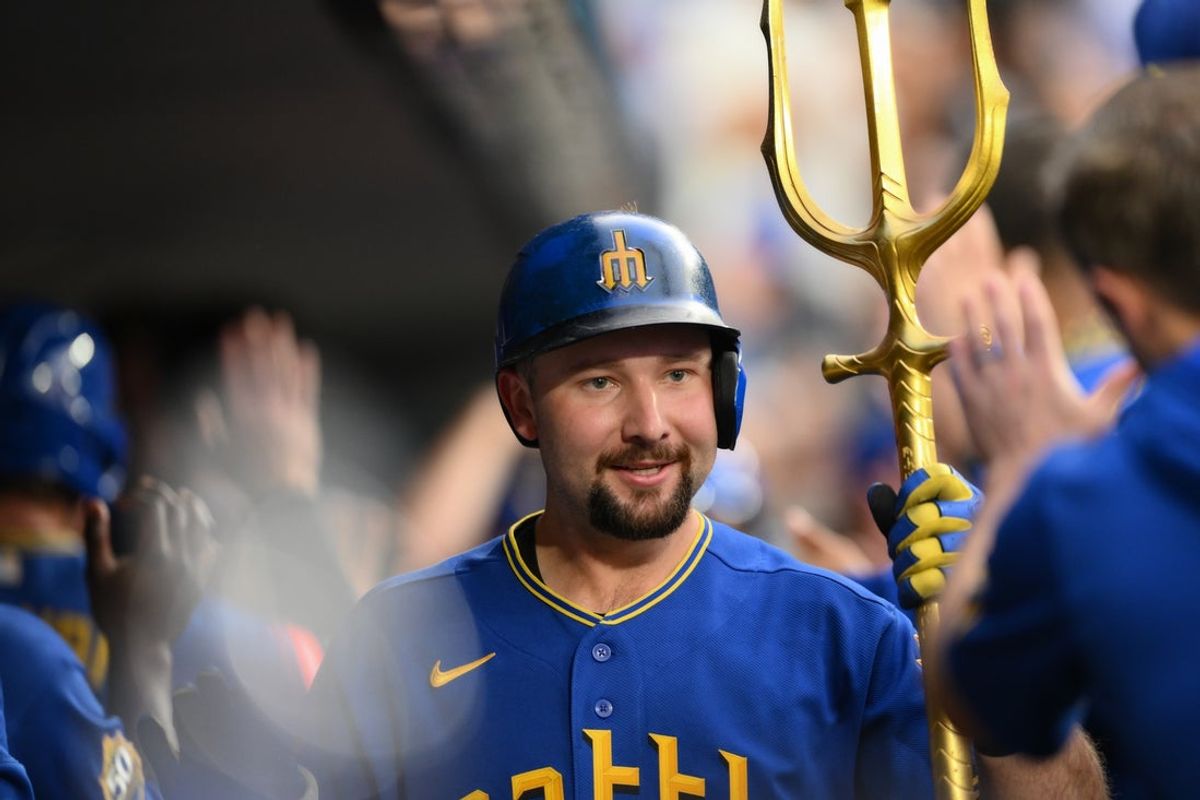 Aug 21, 2026; Seattle, Washington, USA; Seattle Mariners catcher Cal Raleigh (29) celebrates in the dugout after hitting a 3-run home run against the Chicago Cubs during the second innning at T-Mobile Park. Mandatory Credit: Steven Bisig-Imagn Images