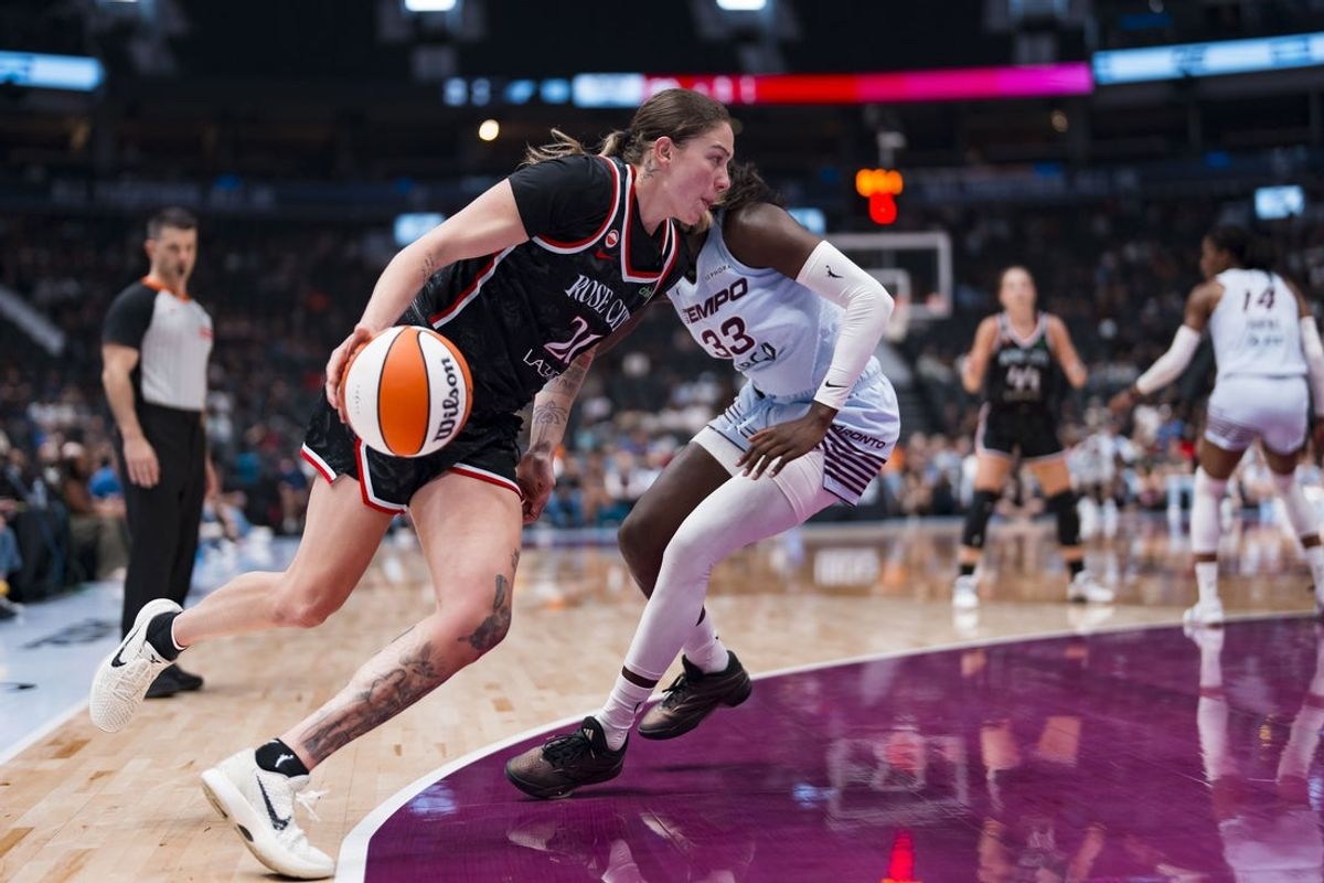 Aug 21, 2026; Vancouver, British Columbia, CAN;  Portland Fire forward Emily Engstler (21) drives past Toronto Tempo forward Ornella Bankole (33) in the first half at Rogers Arena.  Mandatory Credit: Bob Frid-Imagn Images