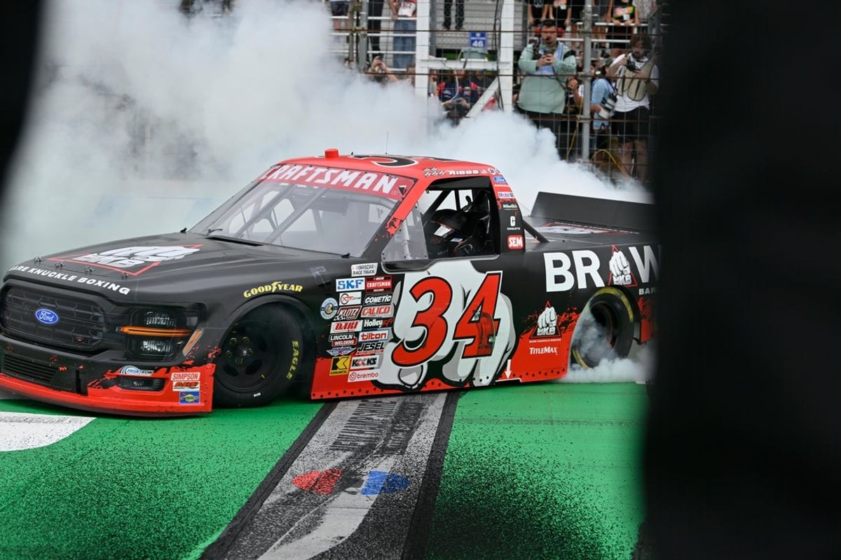 Aug 22, 2026; Loudon, New Hampshire, USA; Front Row Motorsports driver Layne Riggs (34) does a burnout after winning the Team EJP 175 at New Hampshire Motor Speedway. Mandatory Credit: Eric Canha-Imagn Images