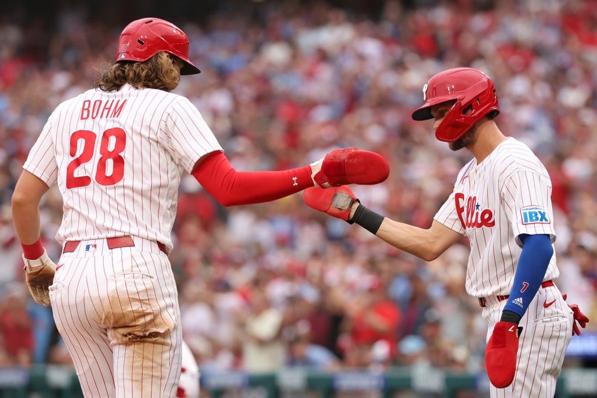 Aug 22, 2026; Philadelphia, Pennsylvania, USA; Philadelphia Phillies third baseman Alec Bohm (28) reacts with shortstop Trea Turner (7) after scoring against the St. Louis Cardinals during the first inning at Citizens Bank Park. Mandatory Credit: Bill Streicher-Imagn Images