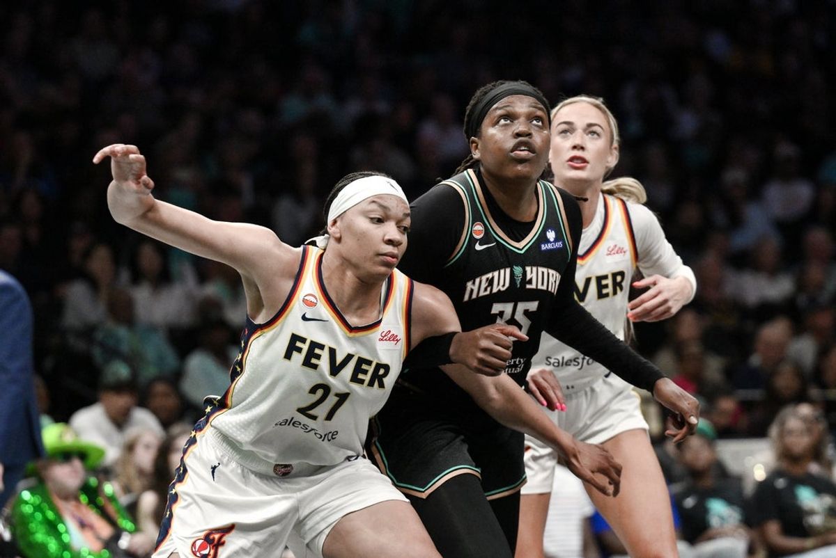 Aug 22, 2026; Brooklyn, New York, USA;  New York Liberty center Jonquel Jones (35) battles for position against Indiana Fever forward Makayla Timpson (21) and Sophie Cunningham (8) during the first half at Barclays Center.  Mandatory Credit: John Jones-Imagn Images