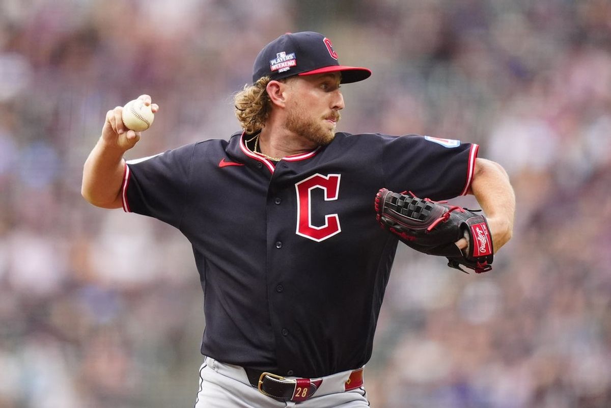 Aug 22, 2026; Denver, Colorado, USA; Cleveland Guardians starting pitcher Tanner Bibee (28) prepares to field the ball to first in the first inning against the Colorado Rockies at Coors Field. Mandatory Credit: Ron Chenoy-Imagn Images