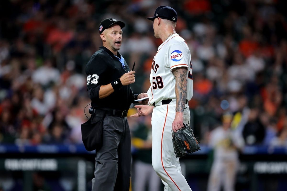 Aug 22, 2026; Houston, Texas, USA;  Houston Astros pitcher Hunter Brown (58) talks with MLB umpire Will Little (93) after being relieved from the game against the Athletics during the sixth inning at Daikin Park.  Mandatory Credit: Erik Williams-Imagn Images