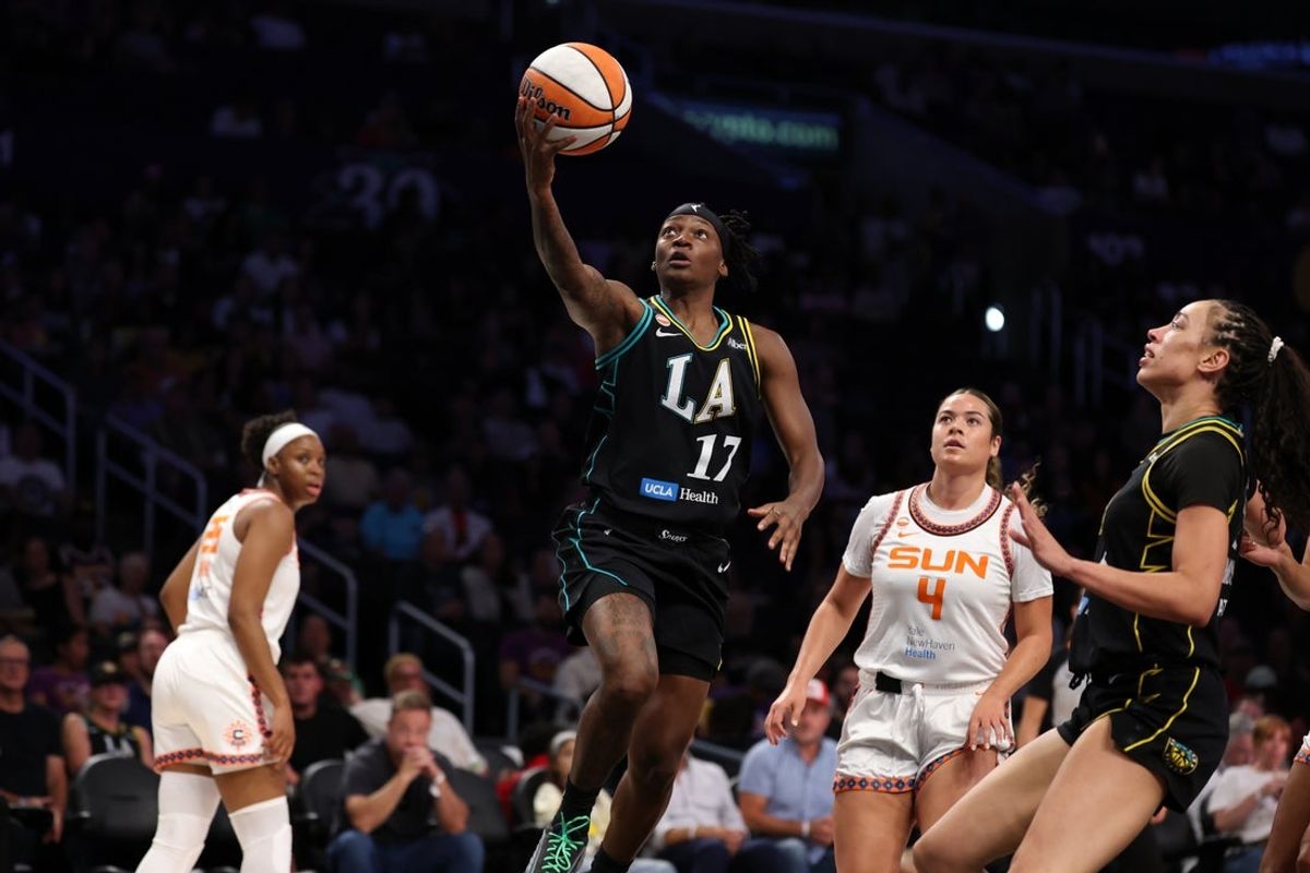 Aug 22, 2026; Los Angeles, California, USA;  Los Angeles Sparks guard Erica Wheeler (17) goes to the basket against Connecticut Sun guard Charlisse Leger-Walker (4) during the first quarter at Crypto.com Arena. Mandatory Credit: Kiyoshi Mio-Imagn Images