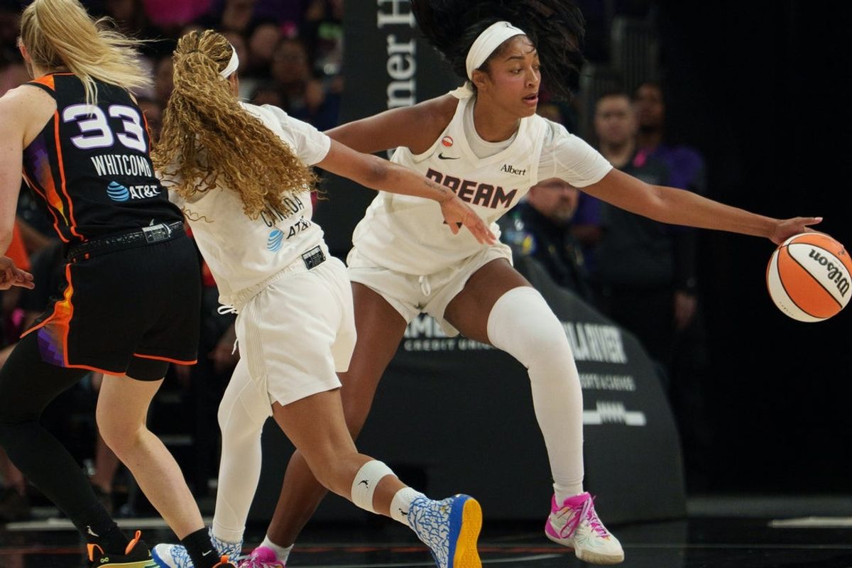 Aug 22, 2026; Phoenix, Arizona, USA;  Atlanta Dream Atlanta Dream forward Angel Reese (5) steals the ball against Phoenix Mercury guard Sami Whitcomb (33) in the first quarter at Mortgage Matchup Center.  Mandatory Credit: Allan Henry-Imagn Images