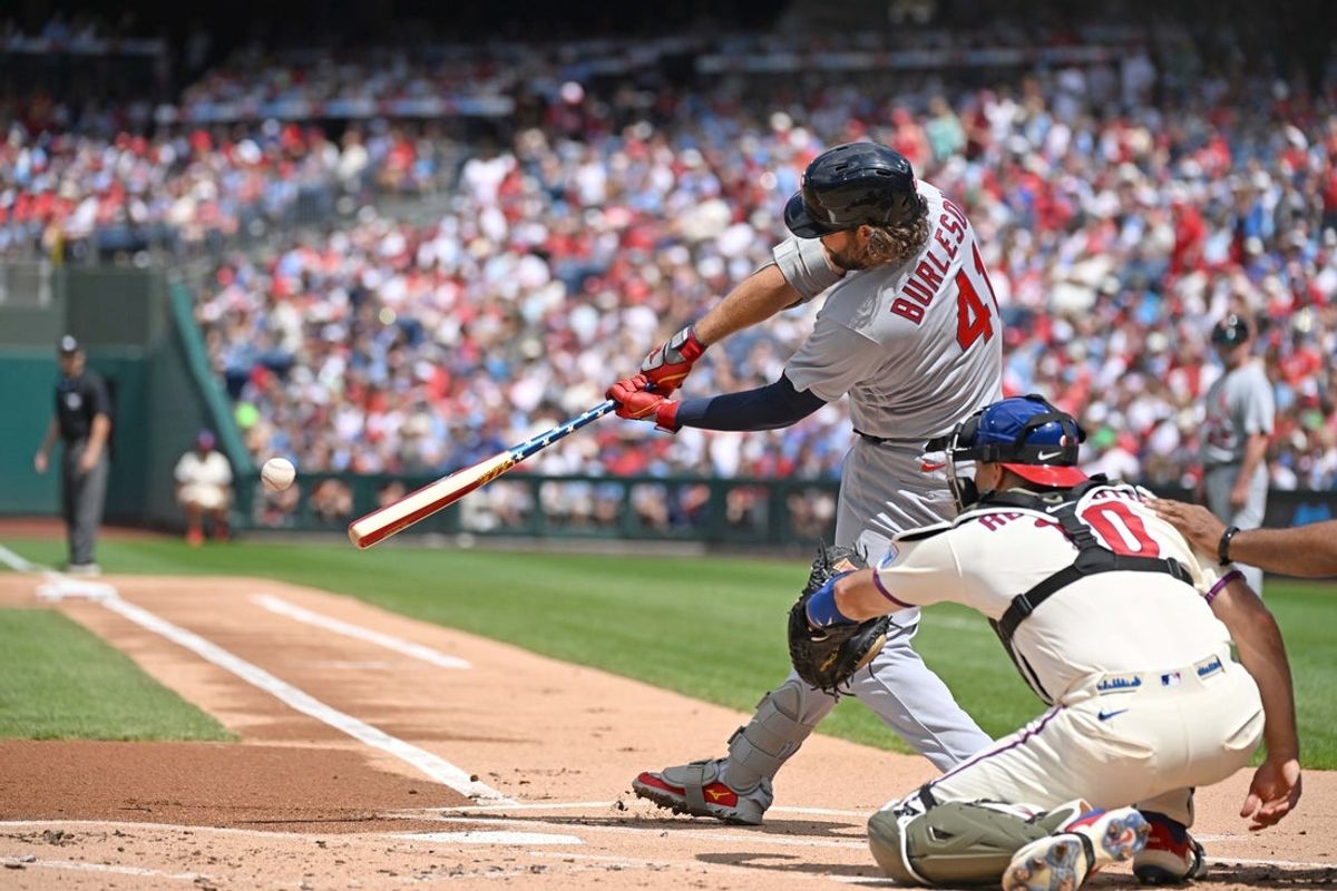 Aug 23, 2026; Philadelphia, Pennsylvania, USA; St. Louis Cardinals first baseman Alec Burleson (41) hits an RBI single during the first inning against the St. Louis Cardinals at Citizens Bank Park. Mandatory Credit: Eric Hartline-Imagn Images