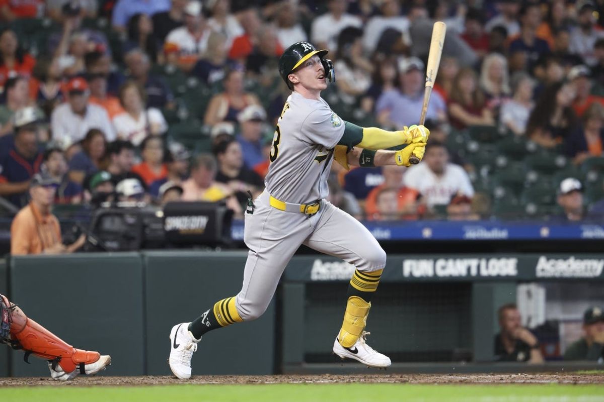 Aug 23, 2026; Houston, Texas, USA; Athletics center fielder Henry Bolte (33) hits a double during the sixth inning against the Houston Astros at Daikin Park. Mandatory Credit: Troy Taormina-Imagn Images