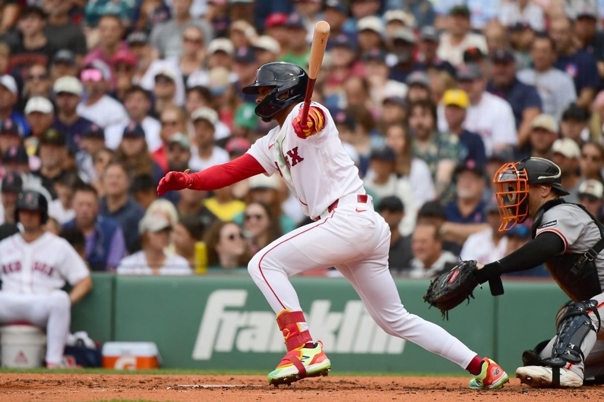 Aug 23, 2026; Boston, Massachusetts, USA;  Boston Red Sox center fielder Ceddanne Rafaela (3) hits an RBI single during the third inning against the San Francisco Giants at Fenway Park. Mandatory Credit: Bob DeChiara-Imagn Images