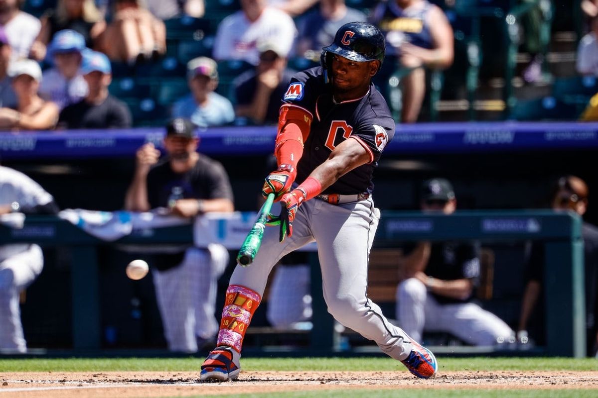 Aug 23, 2026; Denver, Colorado, USA; Cleveland Guardians left fielder Angel Martinez (1) hits an RBI single in the first inning against the Colorado Rockies at Coors Field. Mandatory Credit: Isaiah J. Downing-Imagn Images