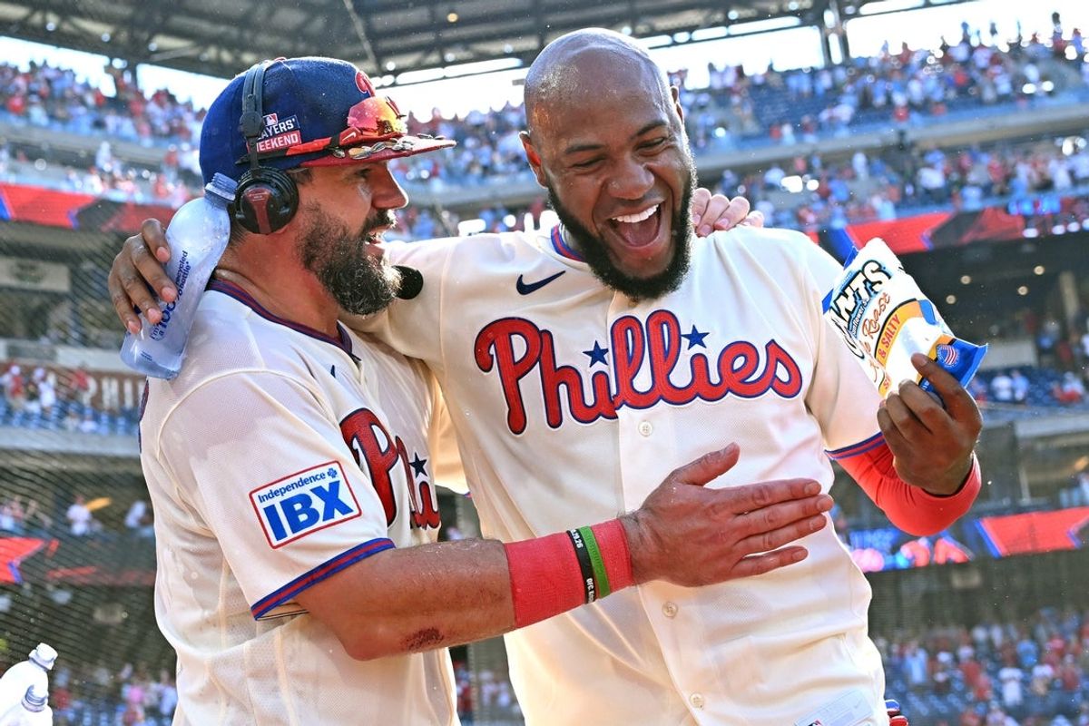 Aug 23, 2026; Philadelphia, Pennsylvania, USA; Philadelphia Phillies designated hitter Kyle Schwarber (12) celebrates his walk-off home run in the ninth inning with right fielder Bryan de la Cruz (41) against the St. Louis Cardinals at Citizens Bank Park. Mandatory Credit: Eric Hartline-Imagn Images