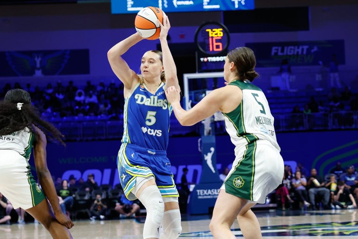 Aug 23, 2026; Arlington, Texas, USA;  Dallas Wings guard Paige Bueckers (5) makes a pass against Seattle Storm guard Jade Melbourne (5) during the first half at College Park Center.  Mandatory Credit: Chris Jones-Imagn Images