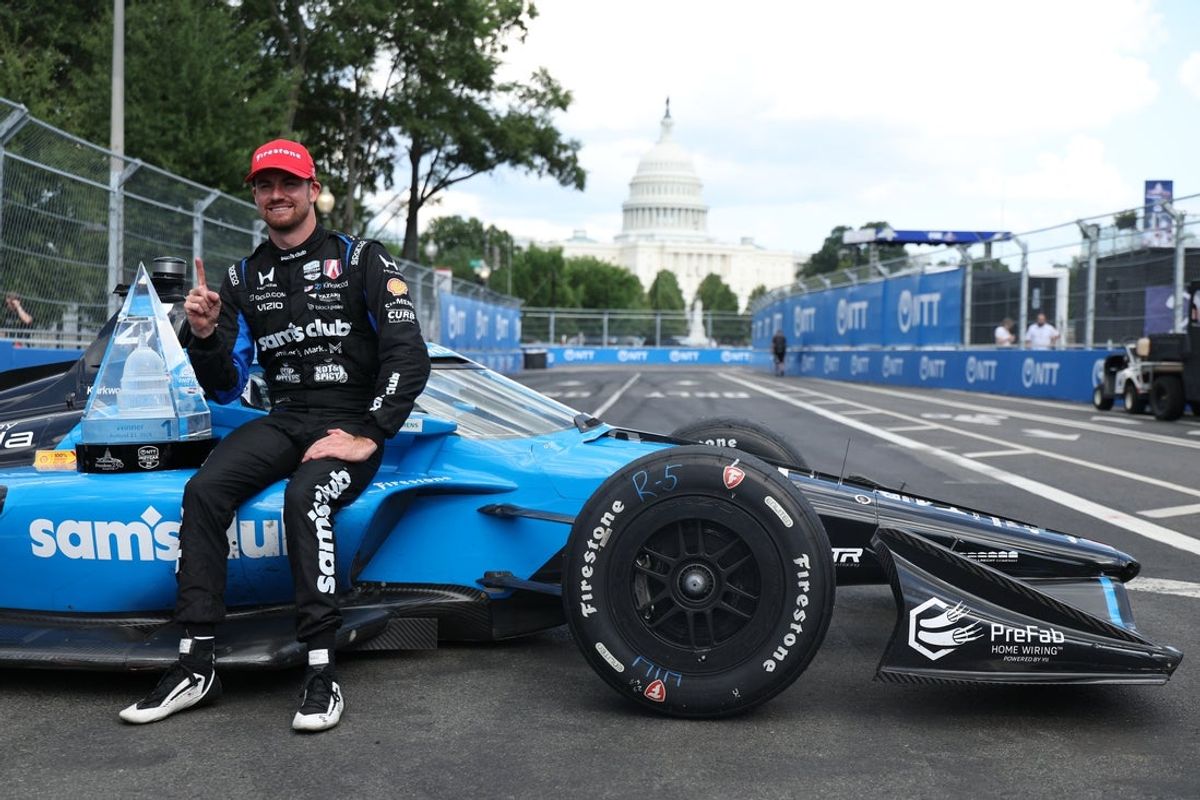 Aug 23, 2026; Washington, D.C., USA; Andretti Global driver Kyle Kirkwood (27) celebrates with the winner's trophy after the Freedom 250 Grand Prix of Washington, D.C. on the street circuit at National Mall. Mandatory Credit: Amber Searls-Imagn Images