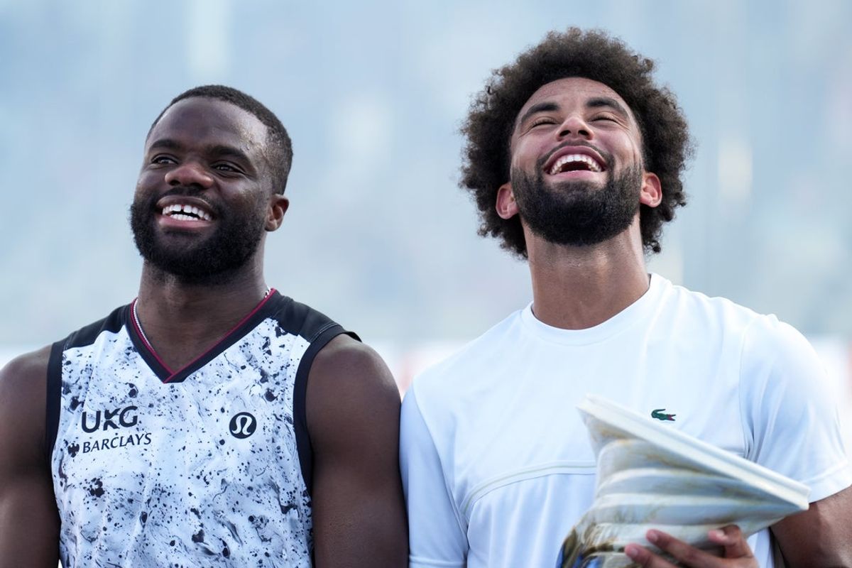 Aug 23, 2026; Cincinnati, OH, USA;  Frances Tiafoe (USA) and Arthur Fils (FRA) pose for photos after their match during the finals of the Cincinnati Open at Lindner Family Tennis Center. Mandatory Credit: Aaron Doster-Imagn Images