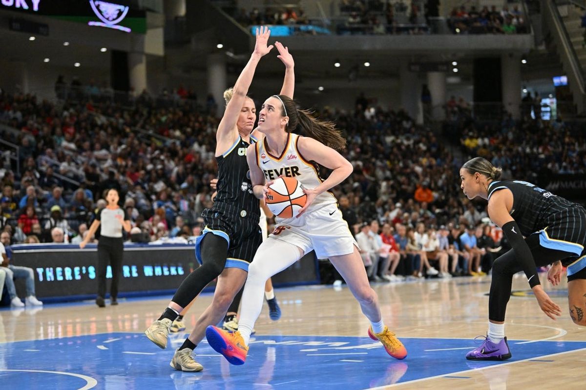 Aug 23, 2026; Chicago, Illinois, USA;  Indiana Fever guard Caitlin Clark (22) drives towards the basket against Chicago Sky guard Courtney Vandersloot (22) during the first half at Wintrust Arena.  Mandatory Credit: Patrick Gorski-Imagn Images
