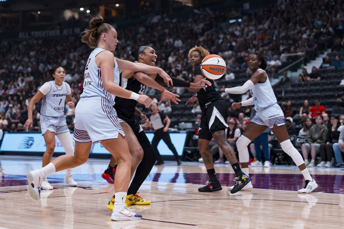 Aug 23, 2026; Vancouver, British Columbia, CAN;  Toronto Tempo forward Laura Juskaite (2) and Las Vegas Aces center A'ja Wilson (22) battle for the loose ball in the first half at Rogers Arena.  Mandatory Credit: Bob Frid-Imagn Images
