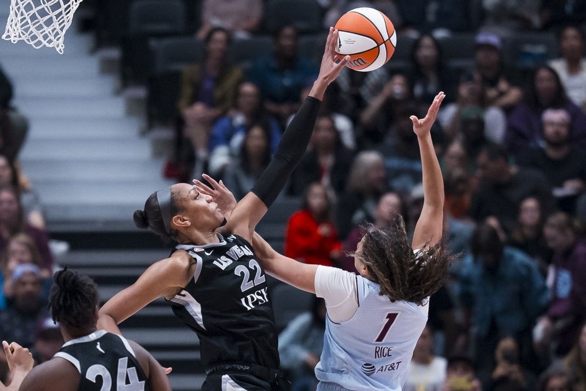 Aug 23, 2026; Vancouver, British Columbia, CAN;  Las Vegas Aces center A'ja Wilson (22) blocks a shot taken by Toronto Tempo guard Kiki Rice (1) in the second half at Rogers Arena.  Mandatory Credit: Bob Frid-Imagn Images