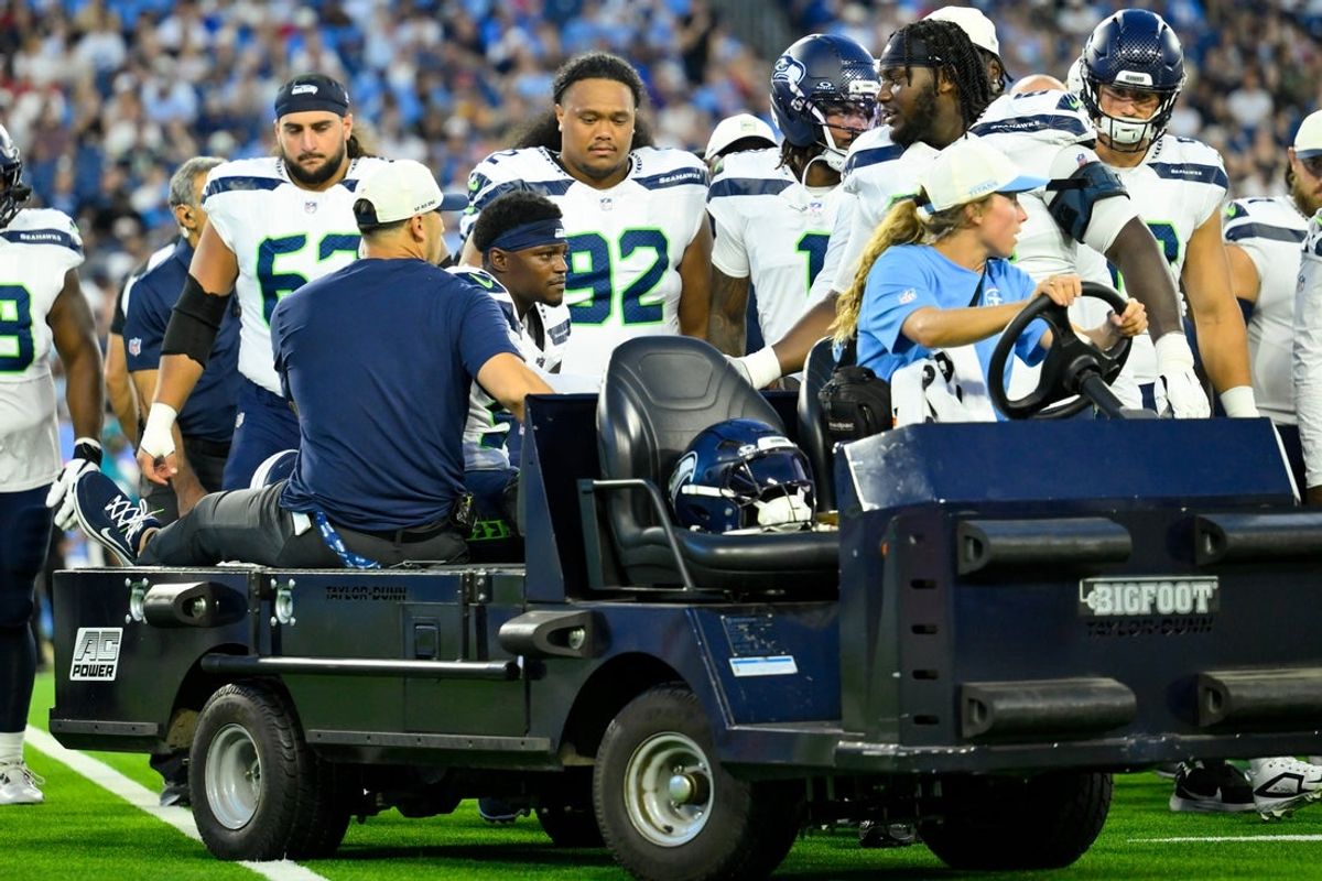 Aug 23, 2026; Nashville, Tennessee, USA;  Seattle Seahawks safety Bud Clark (9) is carted off against the Tennessee Titans during the first half at Nissan Stadium.  Mandatory Credit: Steve Roberts-Imagn Images